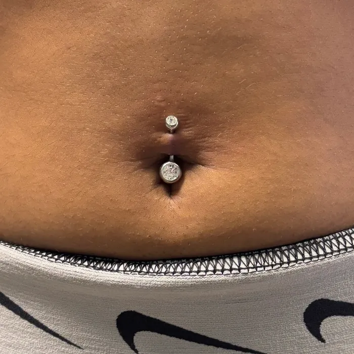 Bellybutton piercing with barbell jewelry