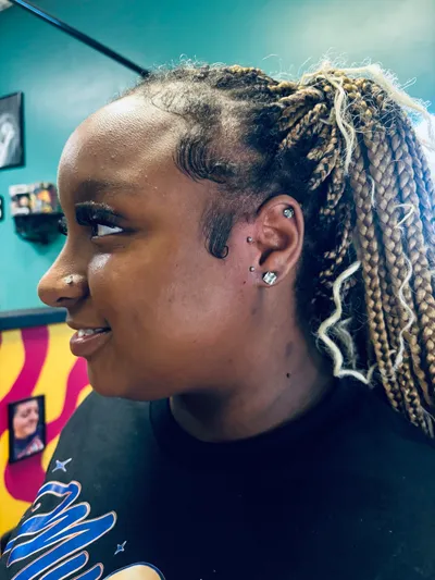 Healed ear cartilage and lobe piercings